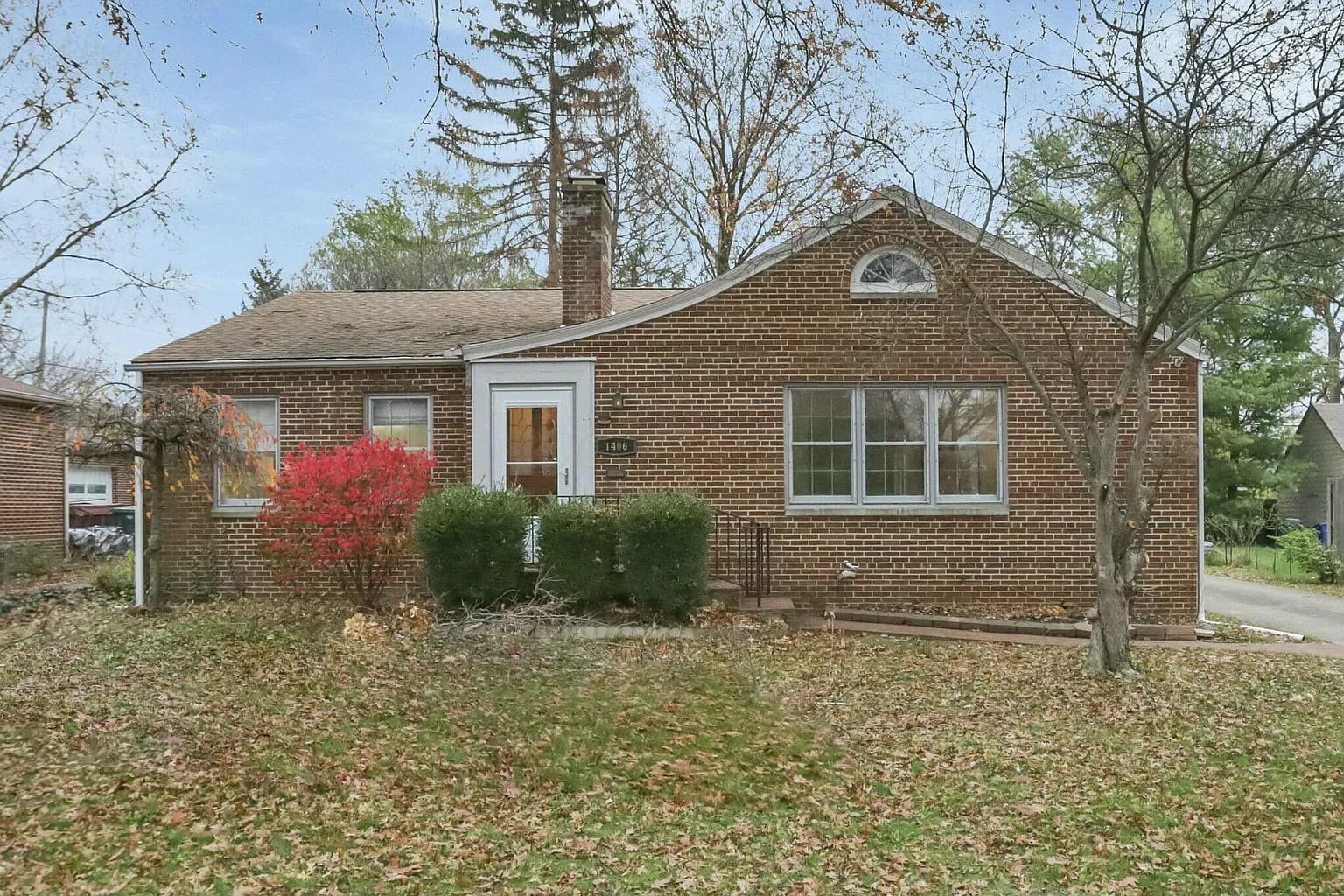 Two-story home with lawn